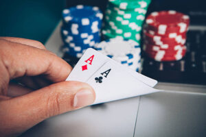 Online play poker hand with two aces